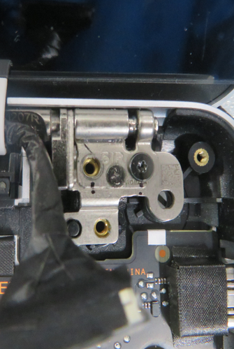 Screenshot that shows holding the AB Cover display while installing hinge screws.