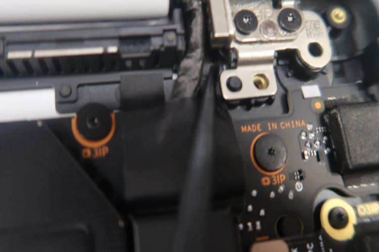 Screenshot that shows securing display connector tape into the gap and crease with the AB Cover Display hinge.