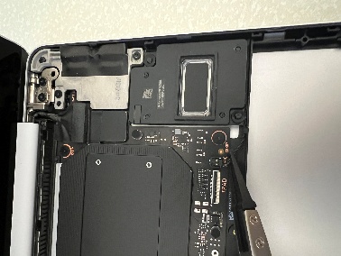 Screenshot of ESD safe tweezers disconnecting right speaker connector from the PCBA.