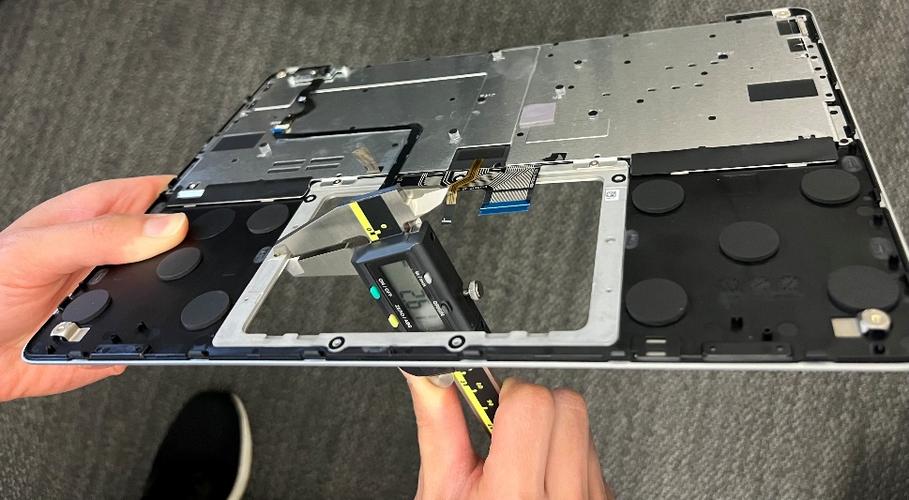 Screenshot that shows using calipers to measure shim and trackpad heights.