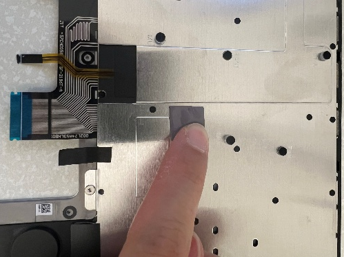 Screenshot that shows aligning and placing the new thermal pad onto the C Cover.