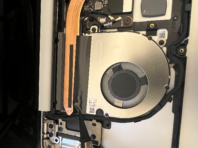 Screenshot that shows removing tape from the fan with tweezers before fan removal.