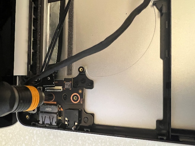 Screenshot that shows USB-A and Audio Jack board to be lifted using fingers and a plastic ESD safe prybar.