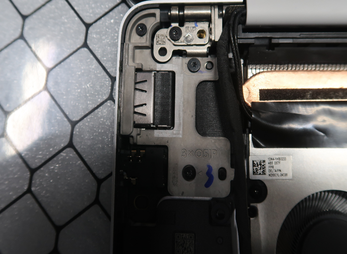 Screenshot that shows the USB-A and Audio Jack bracket installed with screw holes aligned.