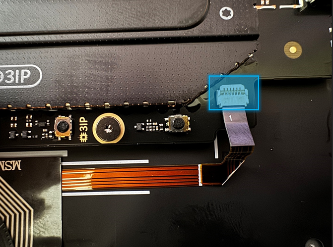Screenshot that shows the keyboard backlight FPC disconnected from the motherboard connector.