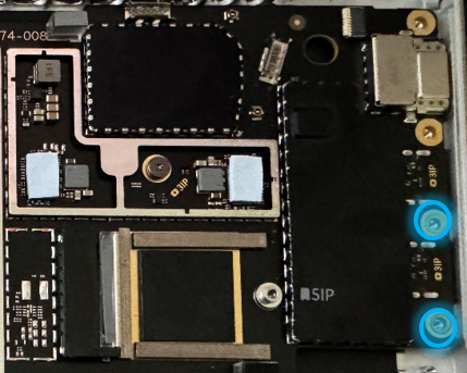 Screenshot that shows the two highlighted motherboard screws being installed.