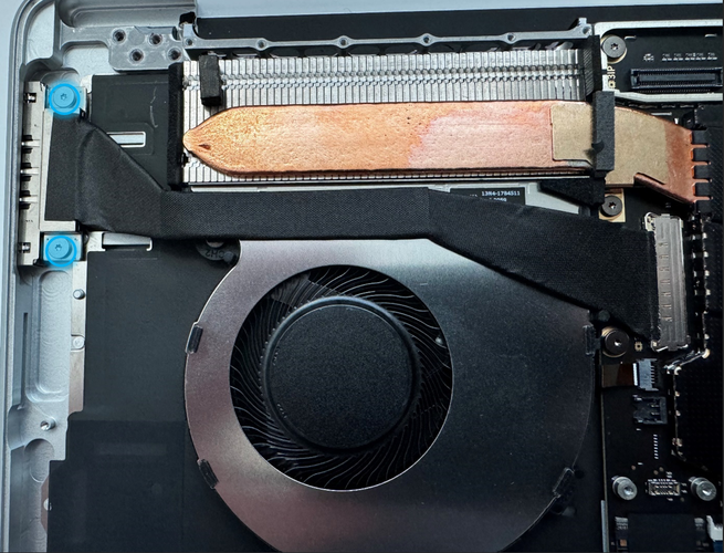 Screenshot that shows the Surface Connect cable being removed near the fan assembly.