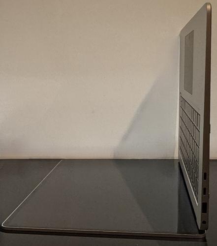 Screenshot that shows a computer on a table.