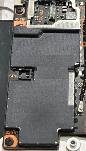 Photo that shows the T3 shield lid being assembled onto the motherboard.