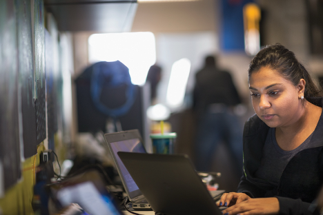 Photo of a person using a laptop.