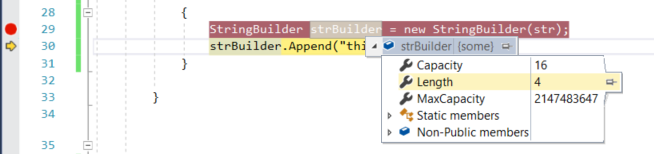 Visual Studio コード ウィンドウのスクリーンショット。黄色でマークされたコード行で変数が選択され、ドロップダウンに現在の値と参照が表示されます。